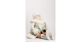 GoodWill Santa figurine in green forest